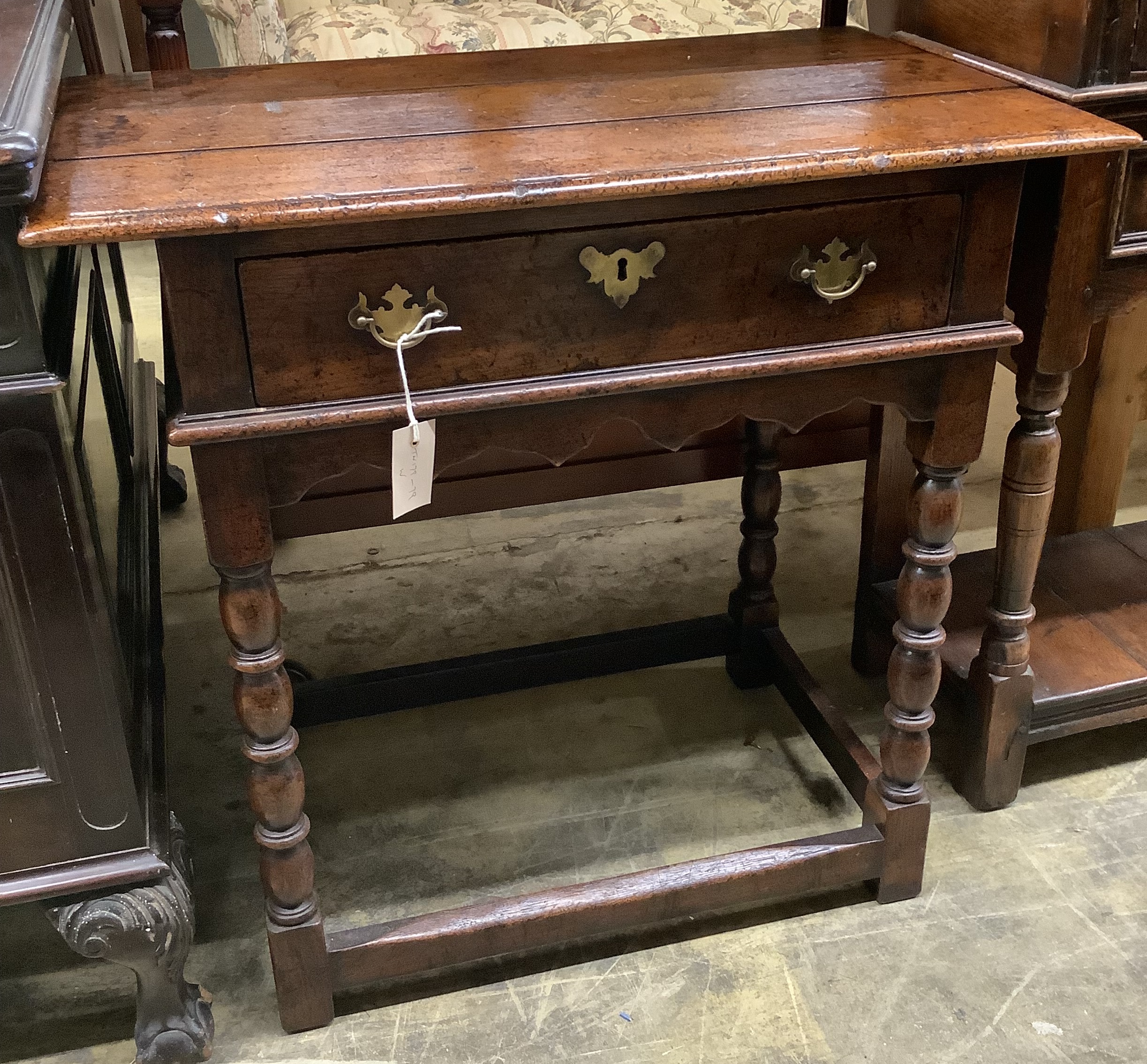 A 17th century style oak side table